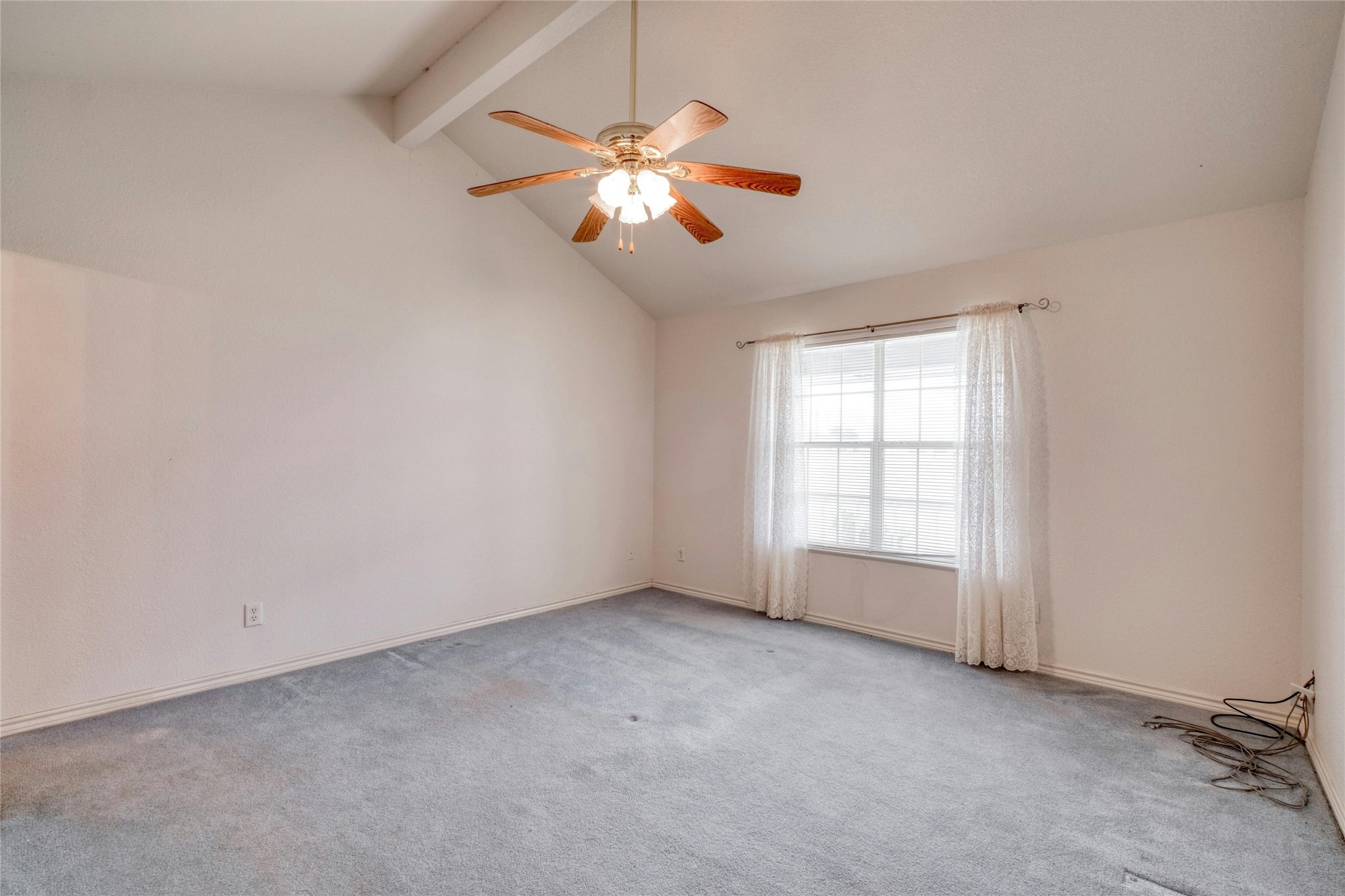 615 County Road 357 Granger, TX 76530 - Photo 17 of 30 an empty room with chandelier fan and windows