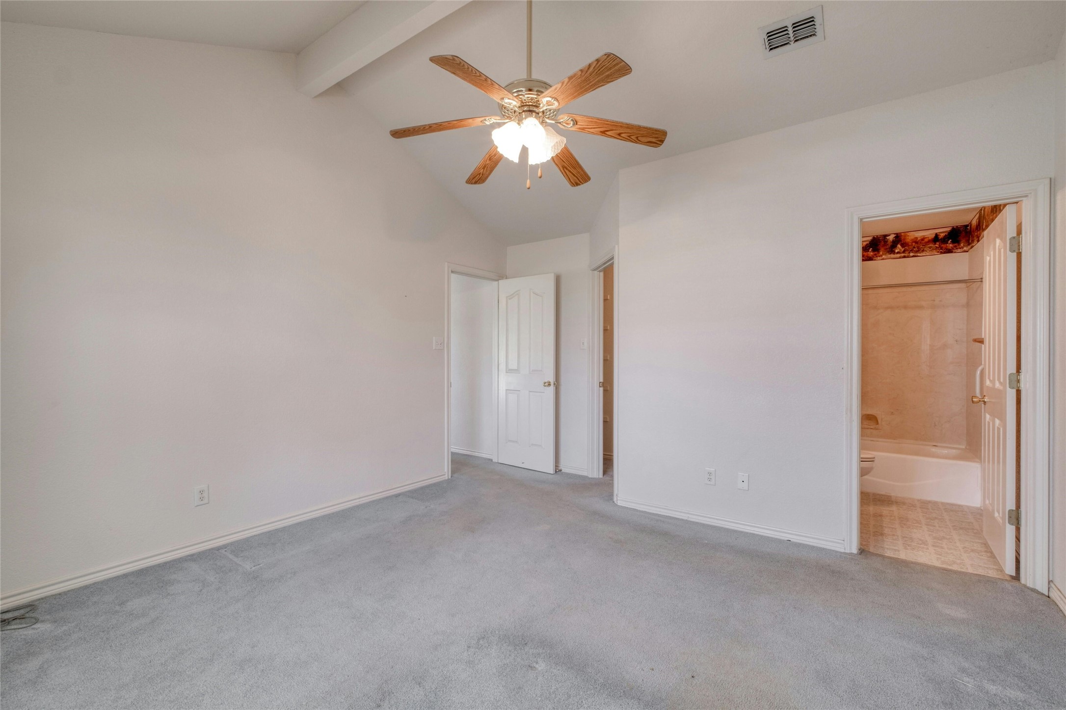 615 County Road 357 Granger, TX 76530 - Photo 19 of 30 an empty room with closet and a chandelier fan