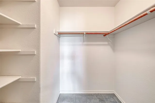 a view of an empty walk in closet
