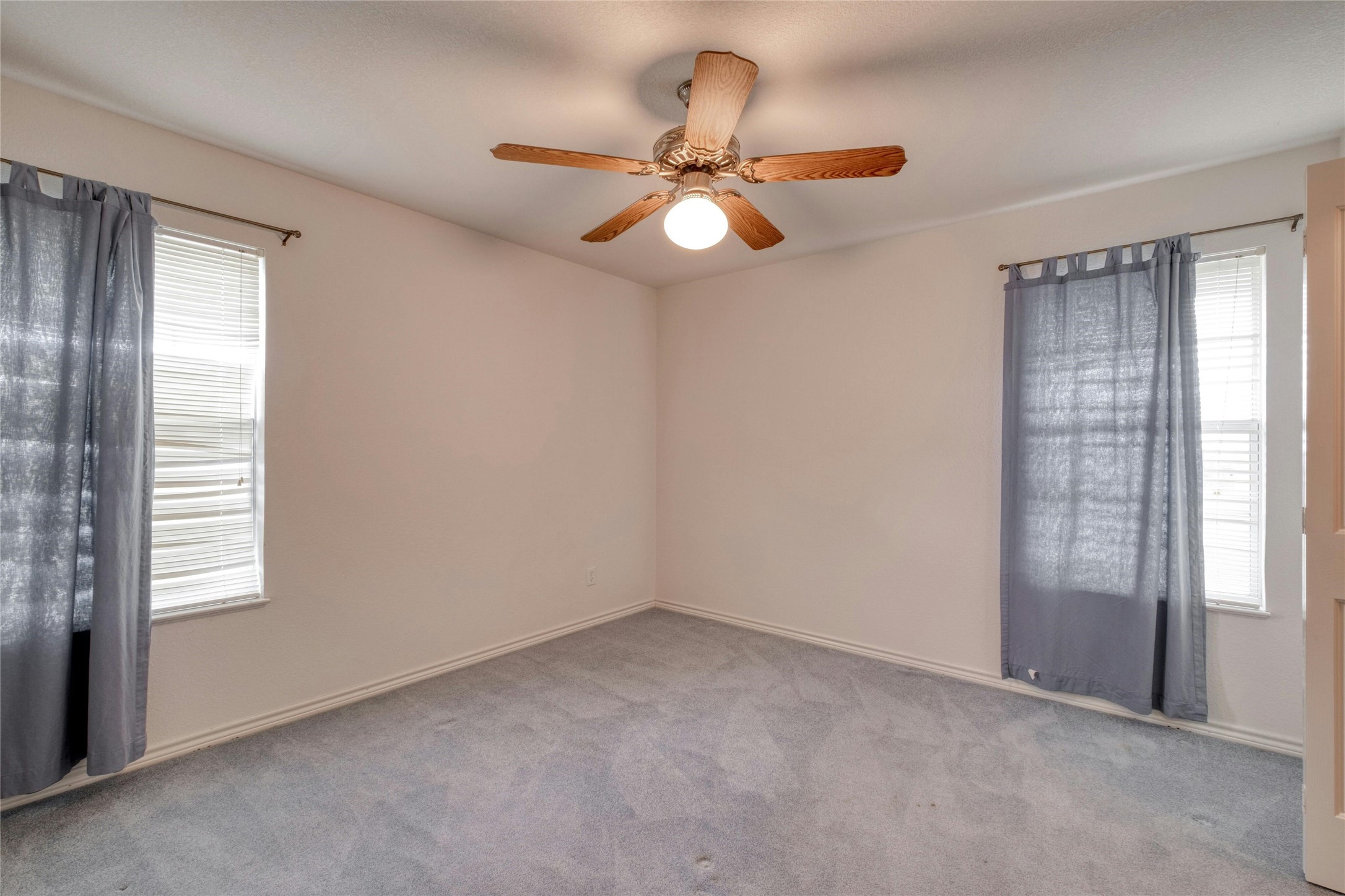 615 County Road 357 Granger, TX 76530 - Photo 23 of 30 an empty room with windows and fan