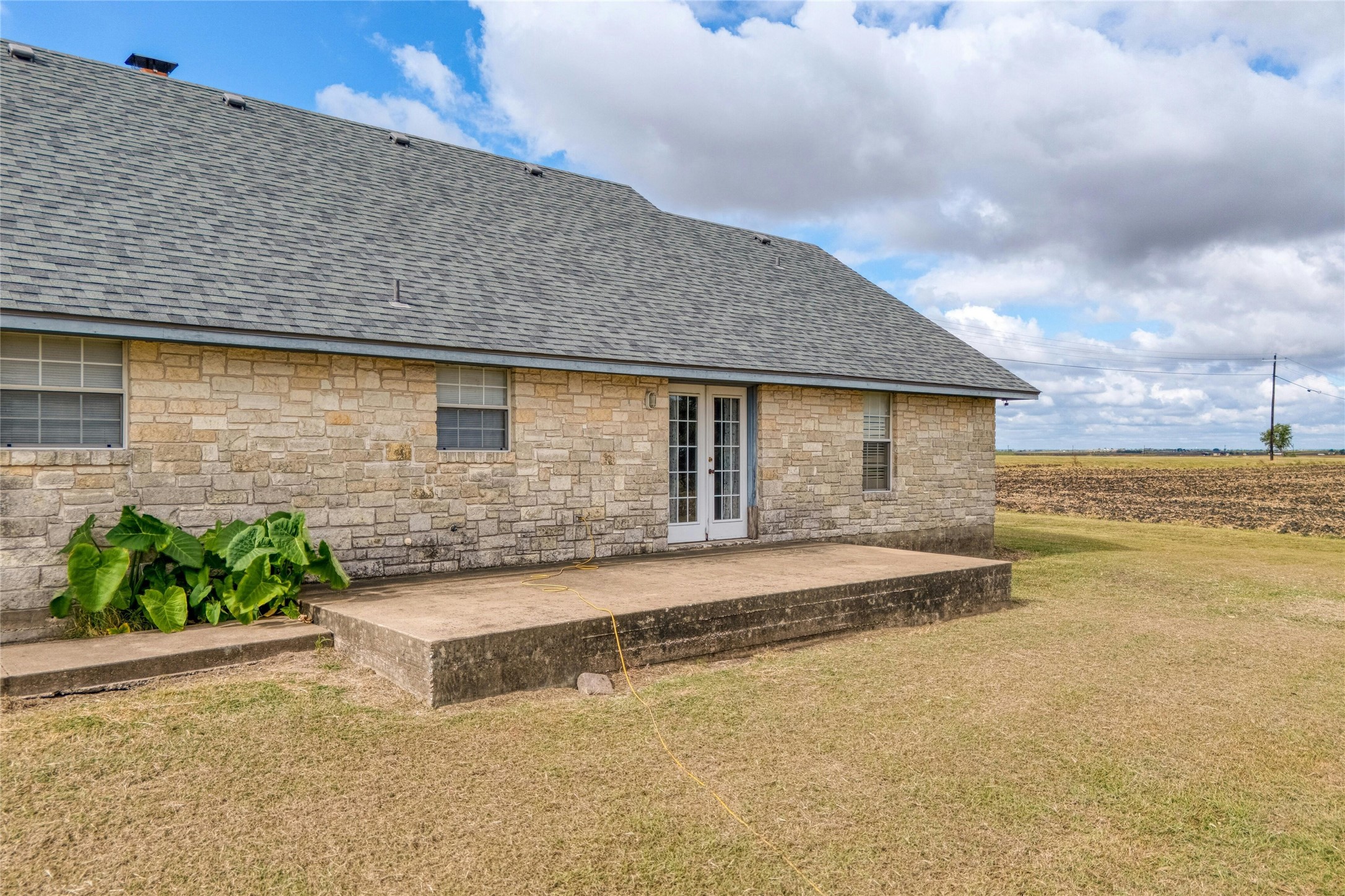 615 County Road 357 Granger, TX 76530 - Photo 27 of 30 a front view of a house with a garden and lake view