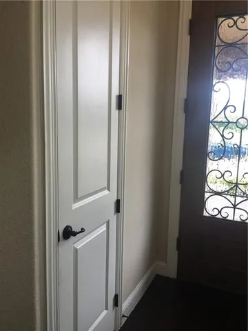 a view of an entryway with table and chair