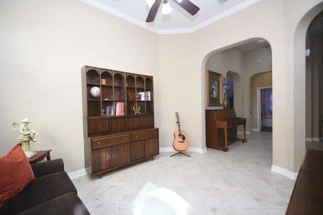 a bathroom with a granite countertop sink a mirror and a shower