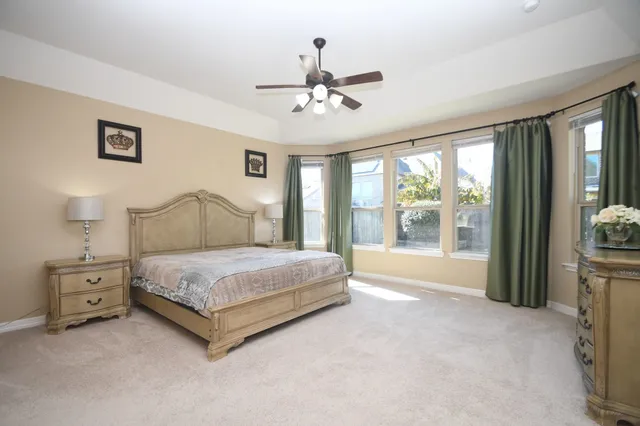 a view of an empty room and a window