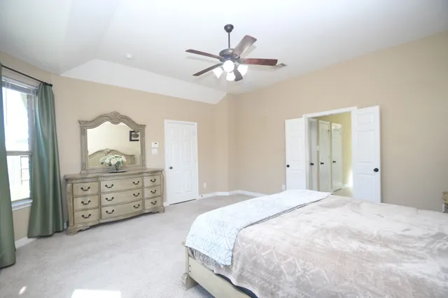 a bathroom with a sink vanity tub and toilet
