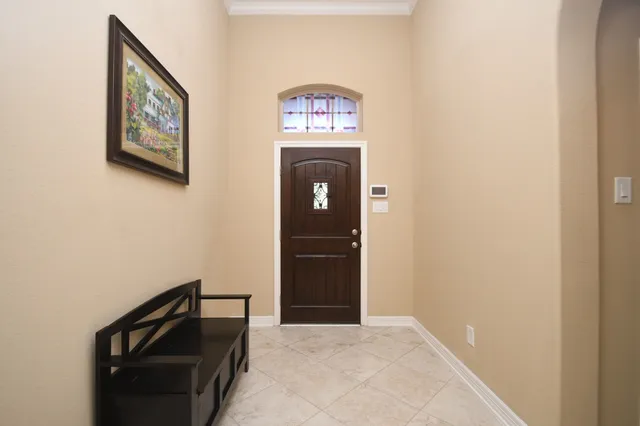 a view of a hallway with front door
