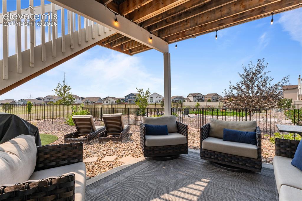 12781 Granite Ridge Drive Peyton, CO 80831 - Photo 32 of 41 Lower level patio overlooking the open space.