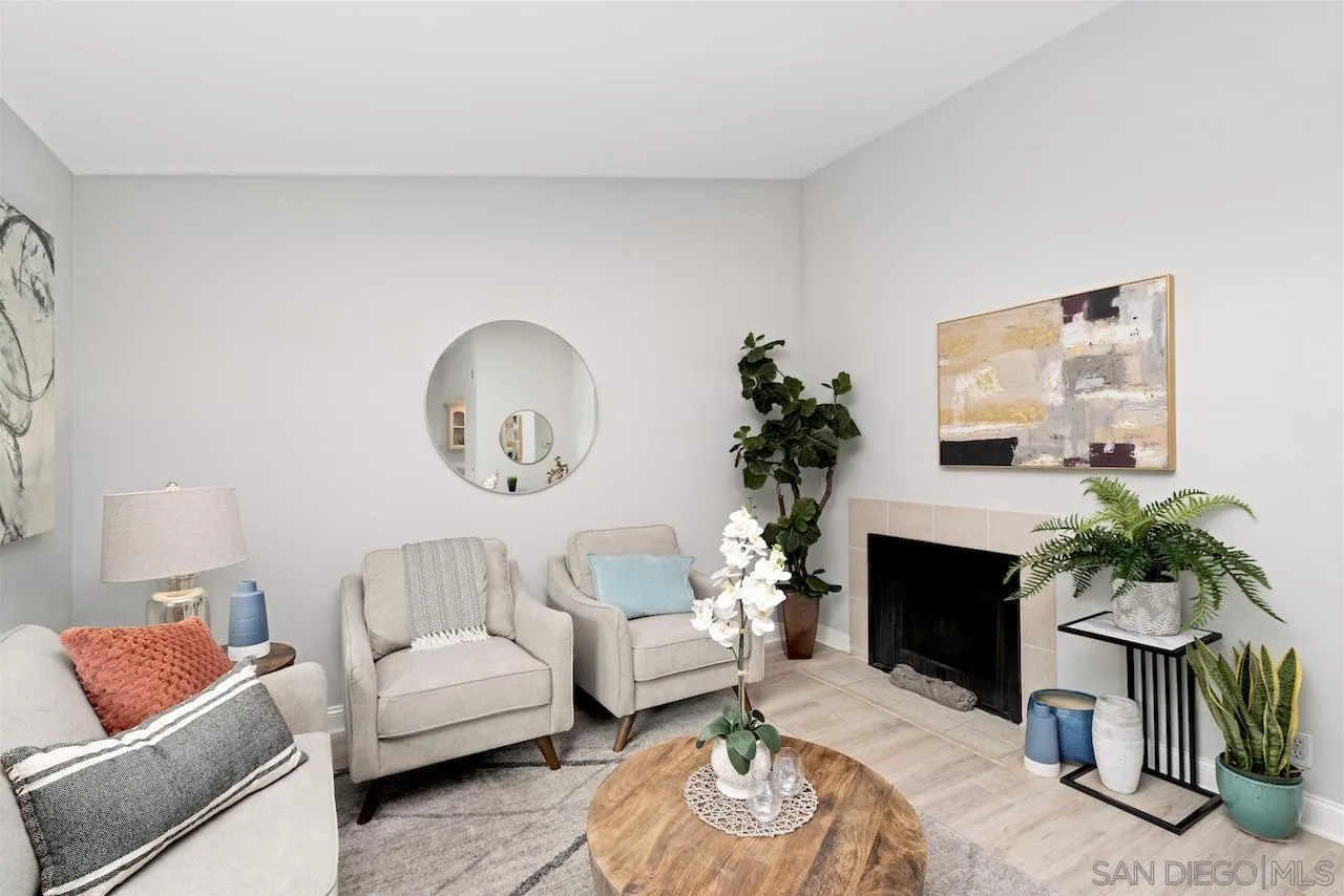 4375 37th Street, Unit 8 San Diego, CA 92105 - Photo 3 of 17 a living room with furniture a fireplace and a potted plant