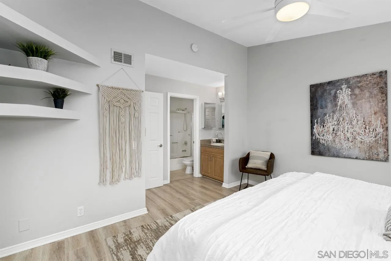 4375 37th Street, Unit 8 San Diego, CA 92105 - Photo 9 of 17 a bedroom with a bed and chair