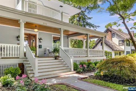 a view of a house with a flower garden