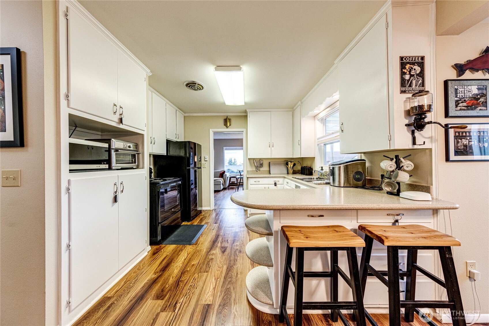 1922 West 7th Street Port Angeles, WA 98363 - Photo 11 of 40 a kitchen with stainless steel appliances kitchen island granite countertop a refrigerator and microwave