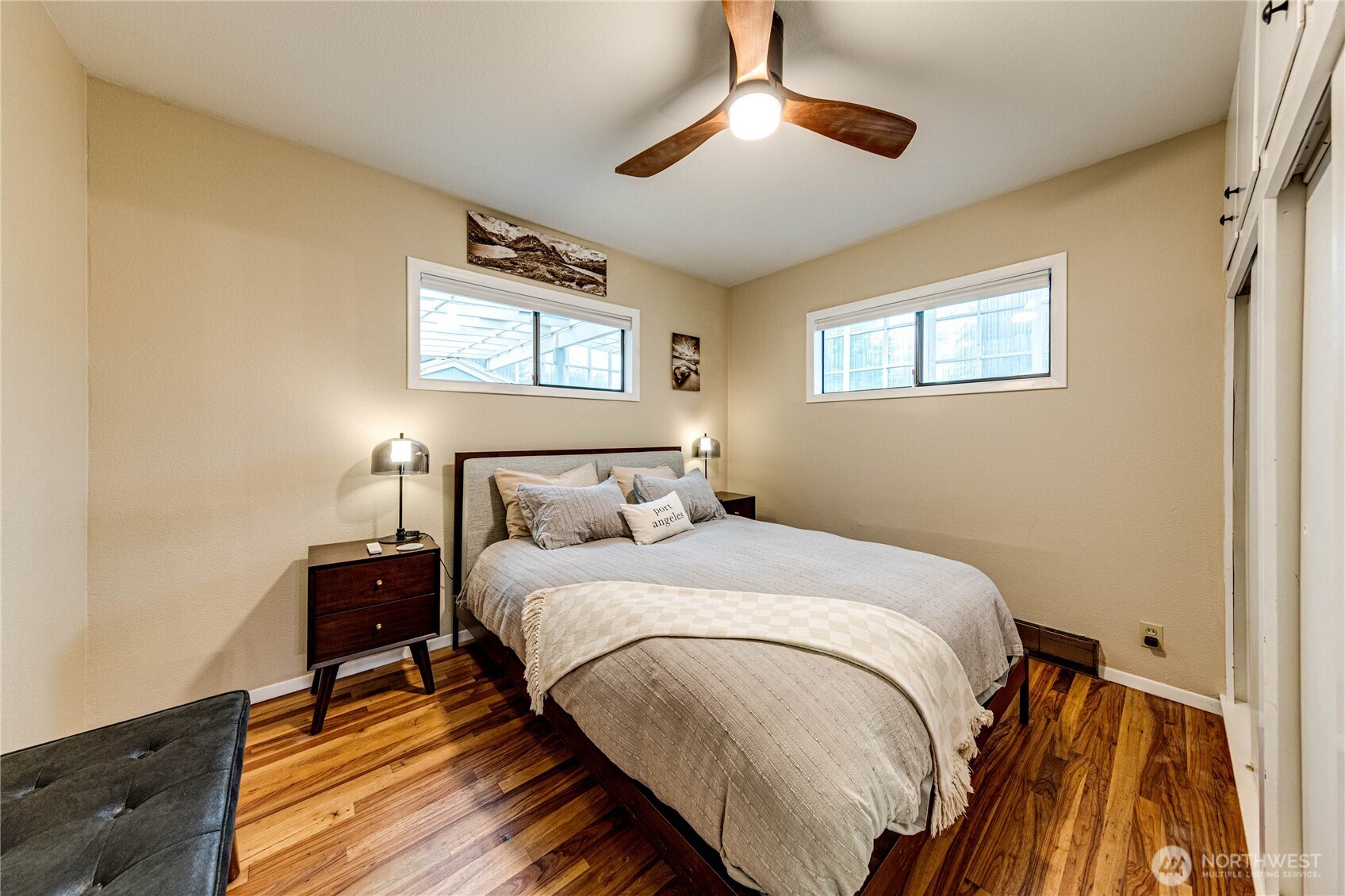 1922 West 7th Street Port Angeles, WA 98363 - Photo 15 of 40 a bedroom with a bed and a chandelier