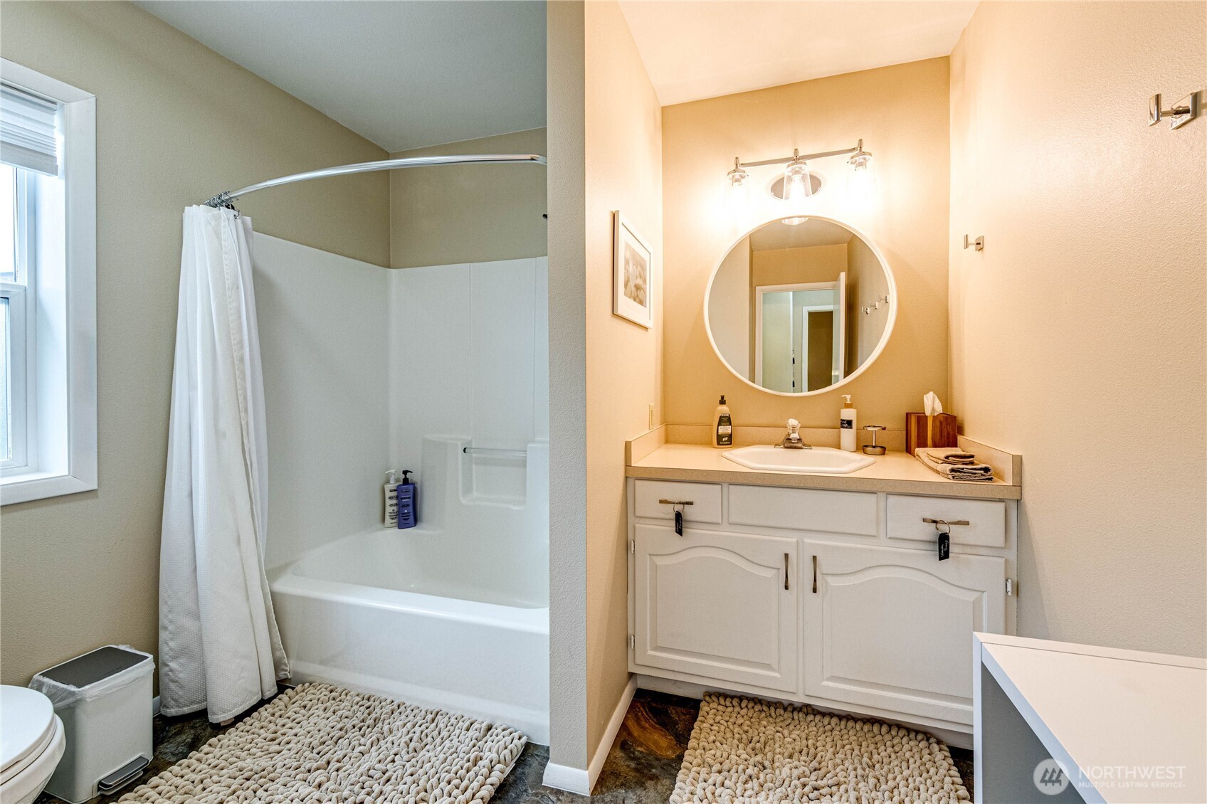 1922 West 7th Street Port Angeles, WA 98363 - Photo 16 of 40 a bathroom with a sink and a mirror
