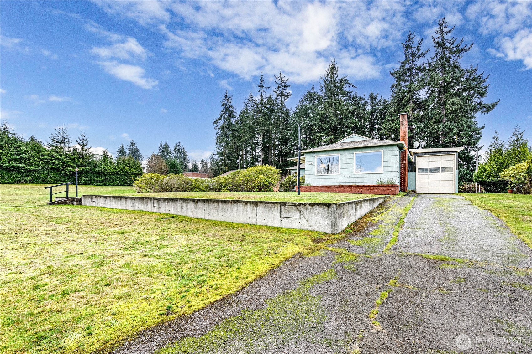 1922 West 7th Street Port Angeles, WA 98363 - Photo 2 of 40 a view of a swimming pool with a yard and plants