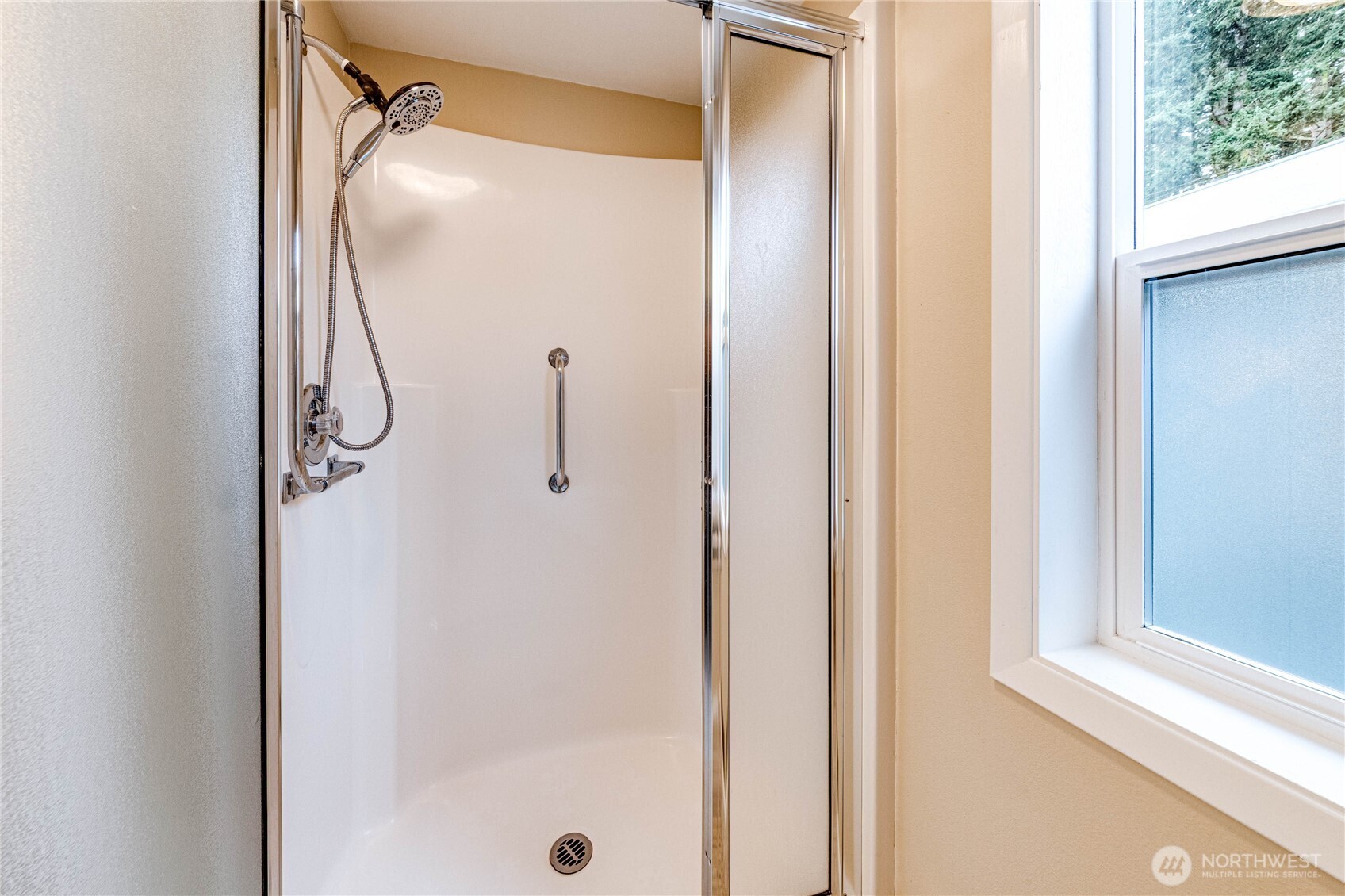 1922 West 7th Street Port Angeles, WA 98363 - Photo 23 of 40 a bathroom with a glass shower door