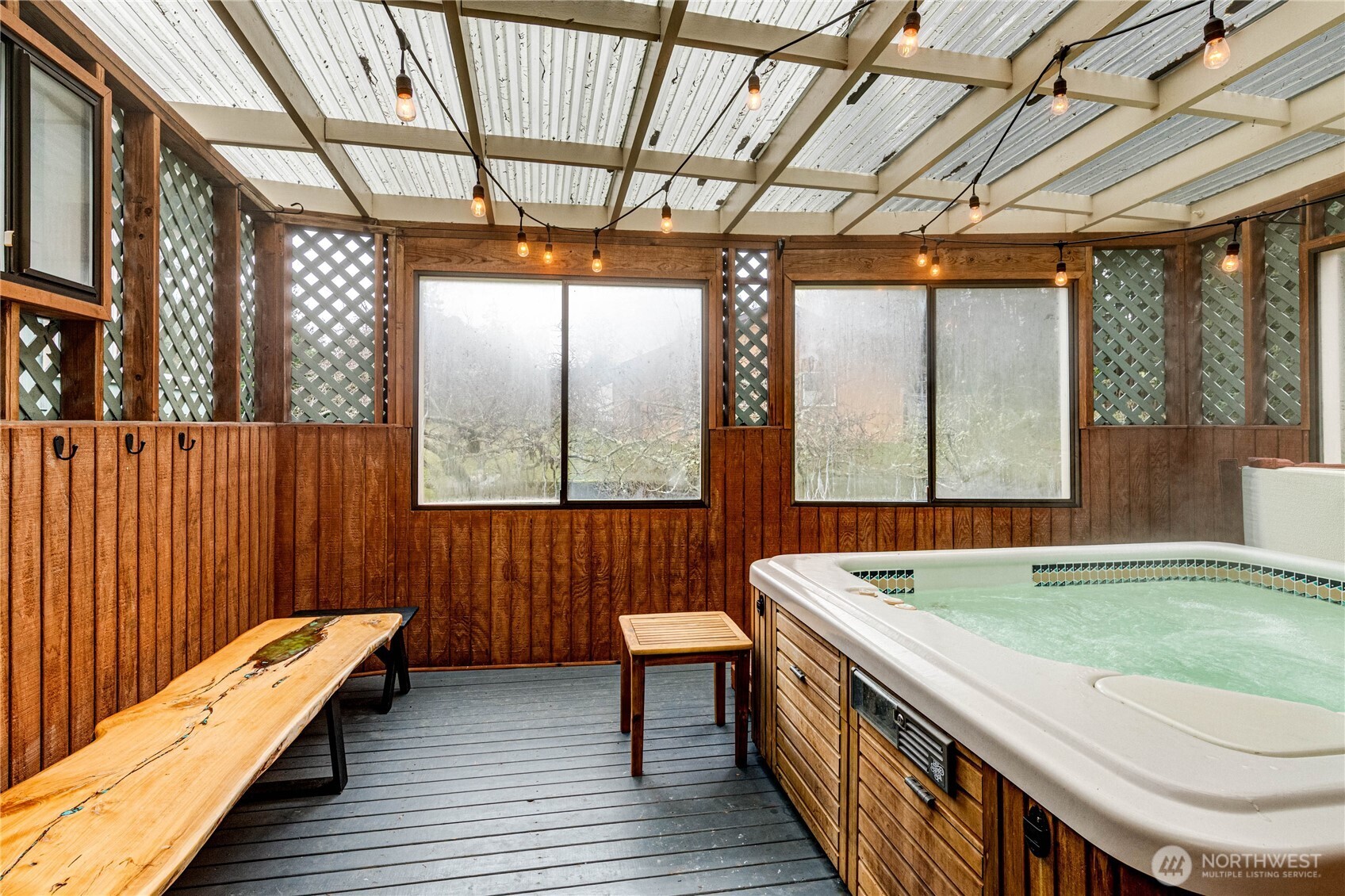 1922 West 7th Street Port Angeles, WA 98363 - Photo 27 of 40 a room with wooden floor table and chairs