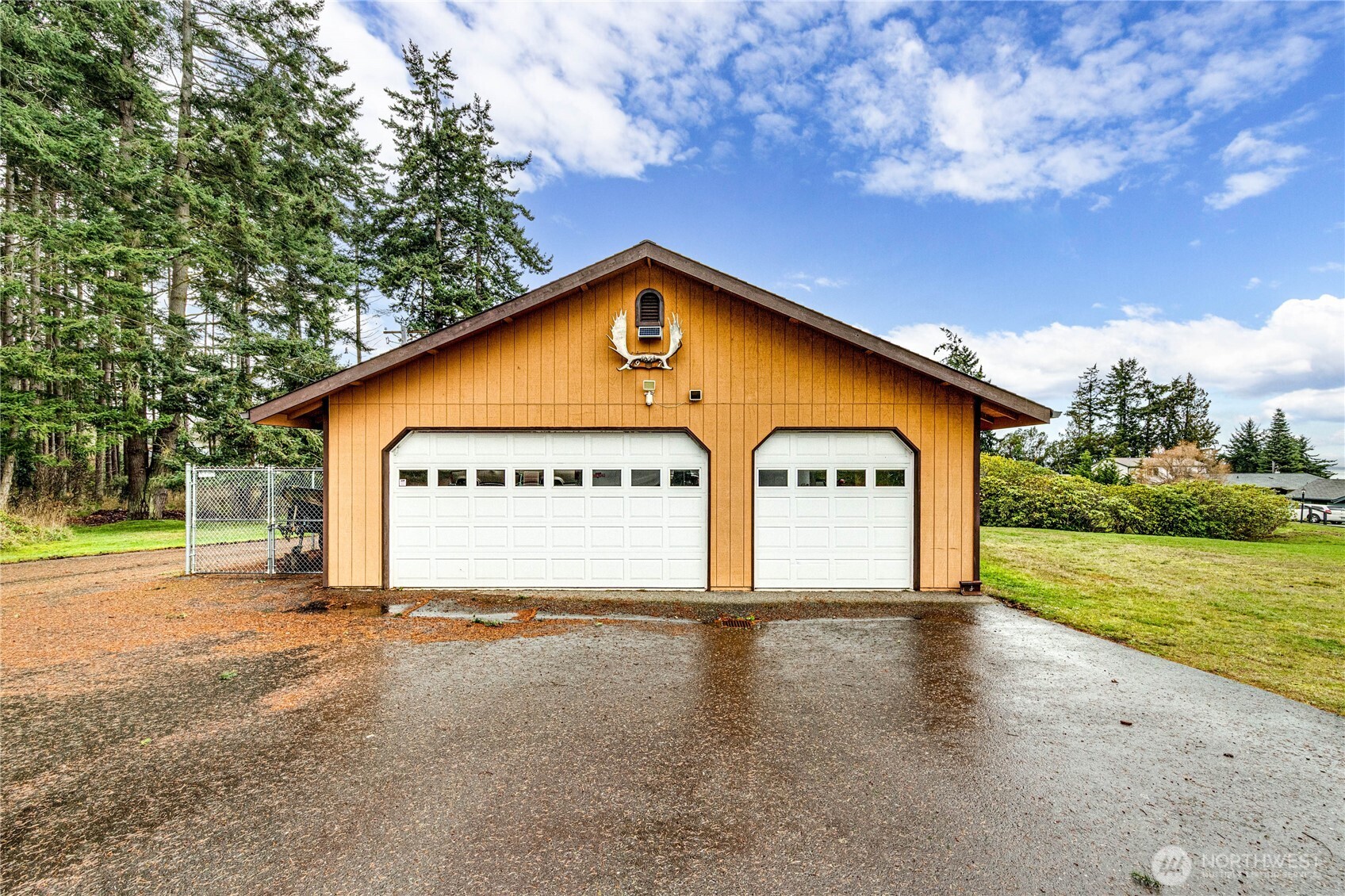 1922 West 7th Street Port Angeles, WA 98363 - Photo 35 of 40 a view of a house with a yard and large tree