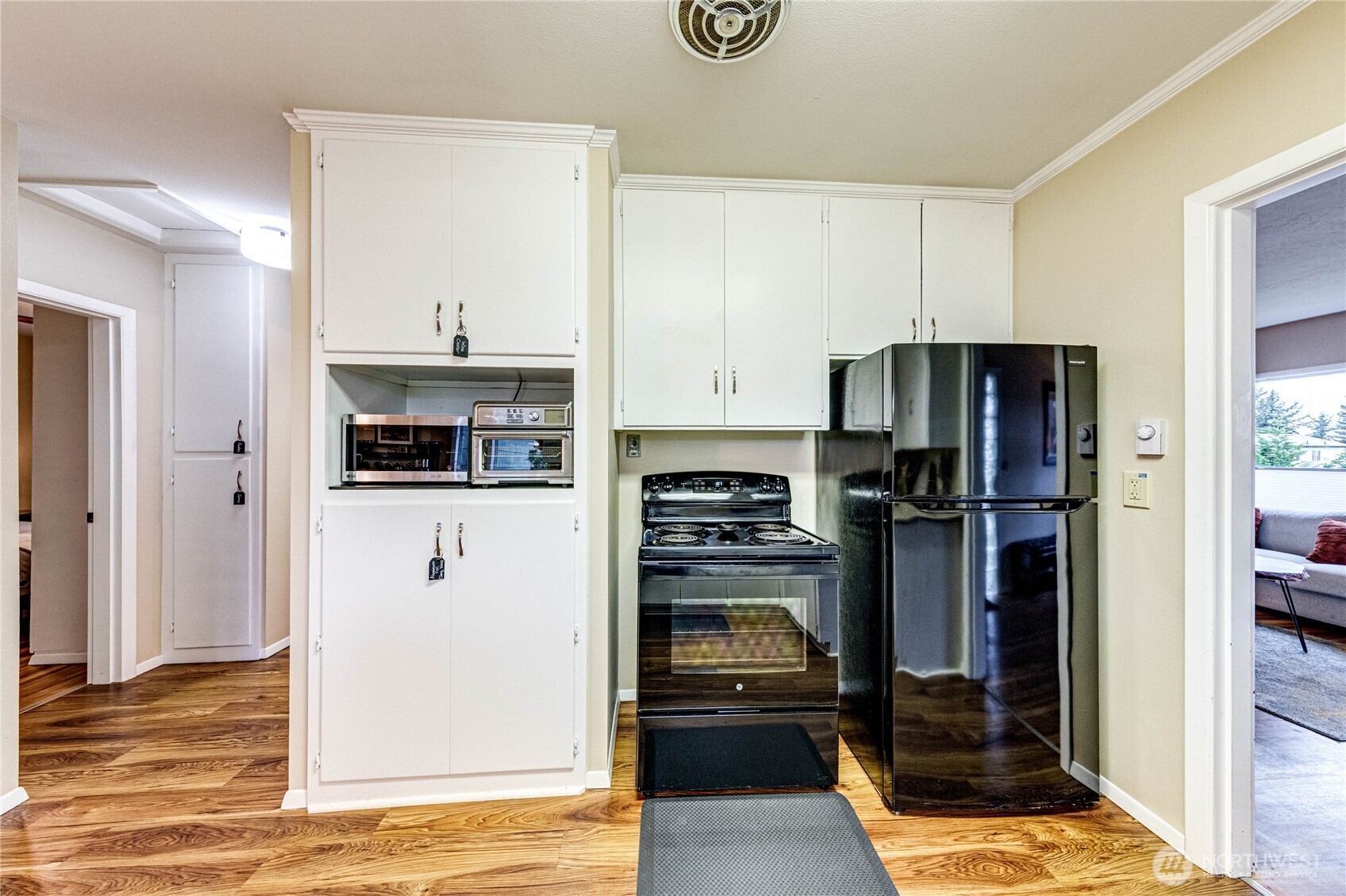1922 West 7th Street Port Angeles, WA 98363 - Photo 10 of 40 a kitchen with stainless steel appliances a refrigerator and a stove top oven