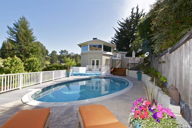 88 Reed Ranch Road Tiburon, CA 94920 - Photo 1 of 1 a view of a swimming pool with a patio