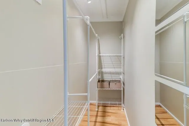 a room with walk in closet and a window