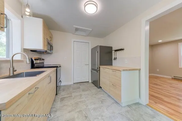 a kitchen with a sink and cabinets
