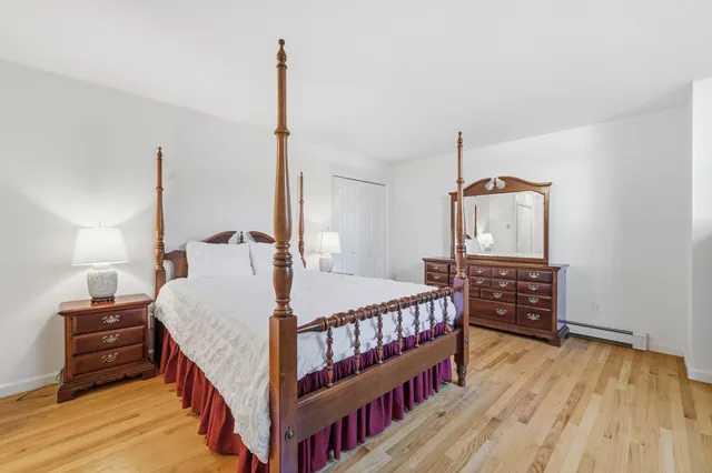 a bed room with bed and a window