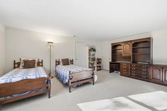 a bedroom with bed and a flat screen tv
