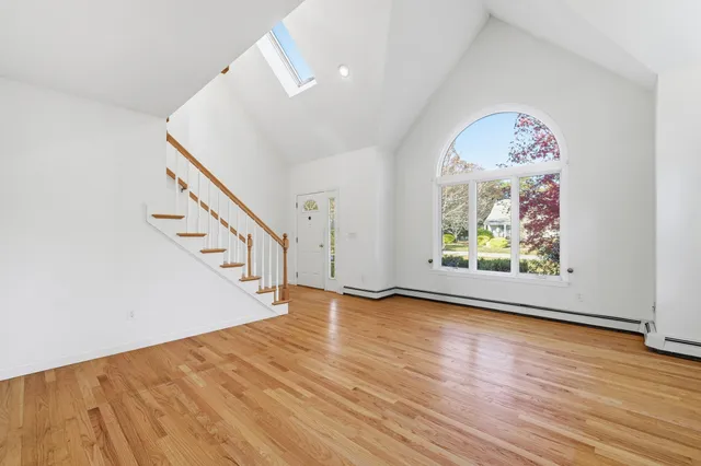 wooden floor in a room with a window
