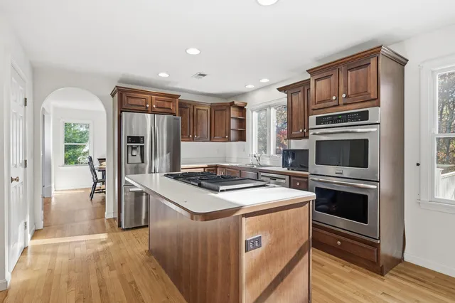 a kitchen with a stove and a refrigerator