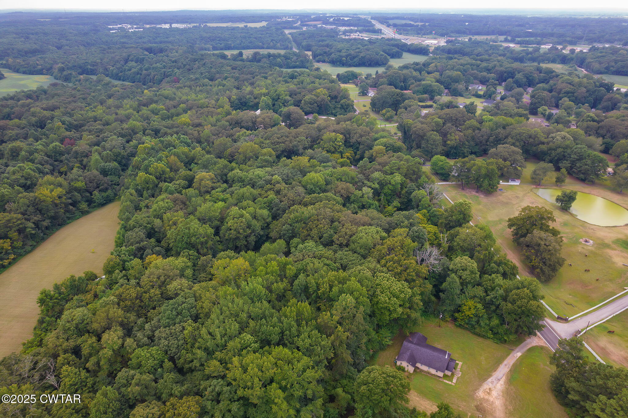 0 Us-412 Jackson, TN 38305 - Photo 6 of 9 an aerial view of a house with a yard