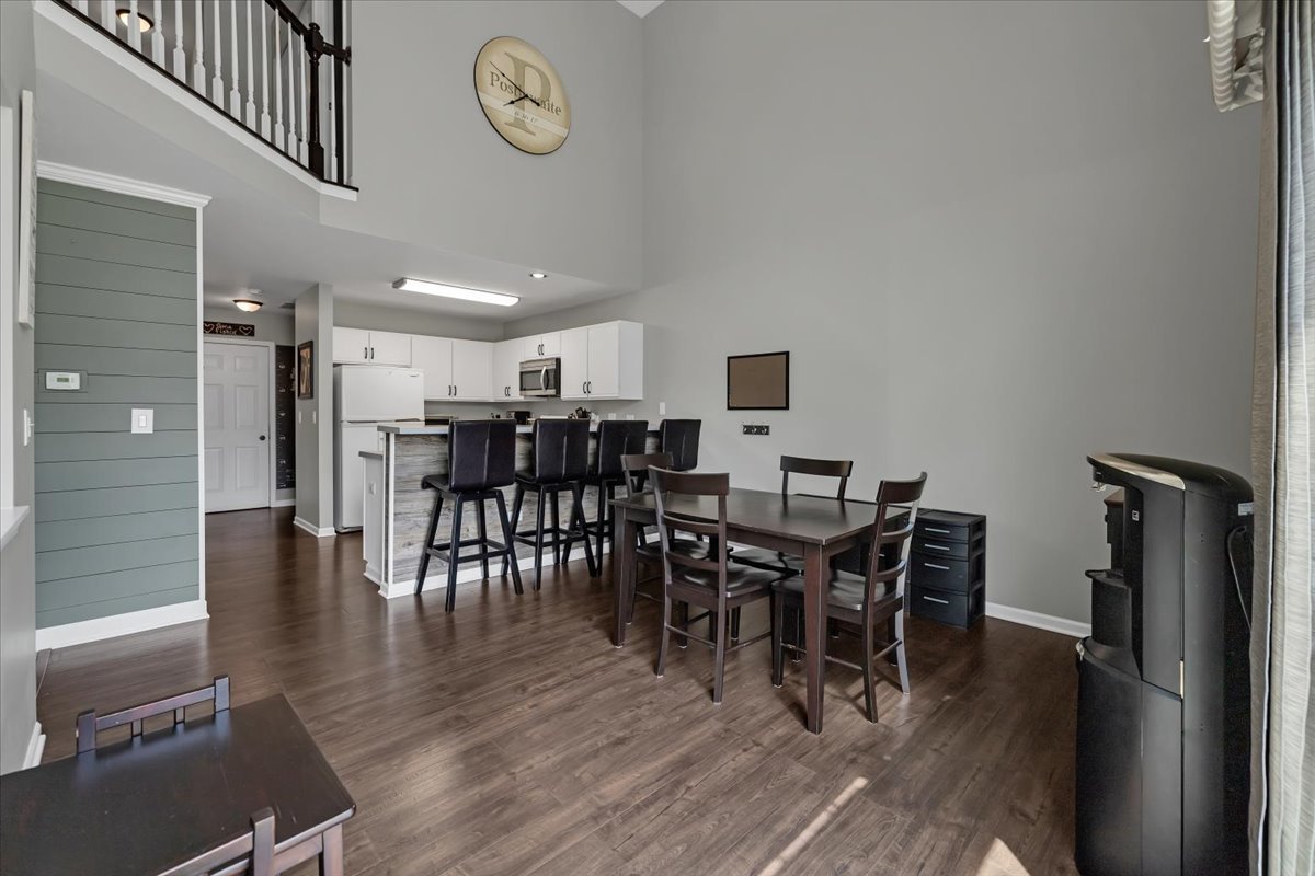 2070 Constitution Court Elgin, IL 60123 - Photo 12 of 29 a view of a dining room with furniture and wooden floor