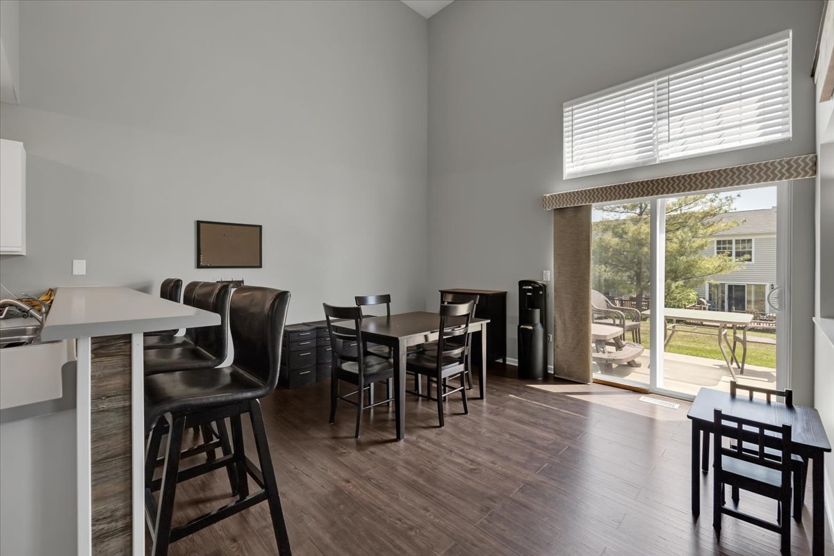 2070 Constitution Court Elgin, IL 60123 - Photo 13 of 29 a view of a dining room with furniture window and wooden floor