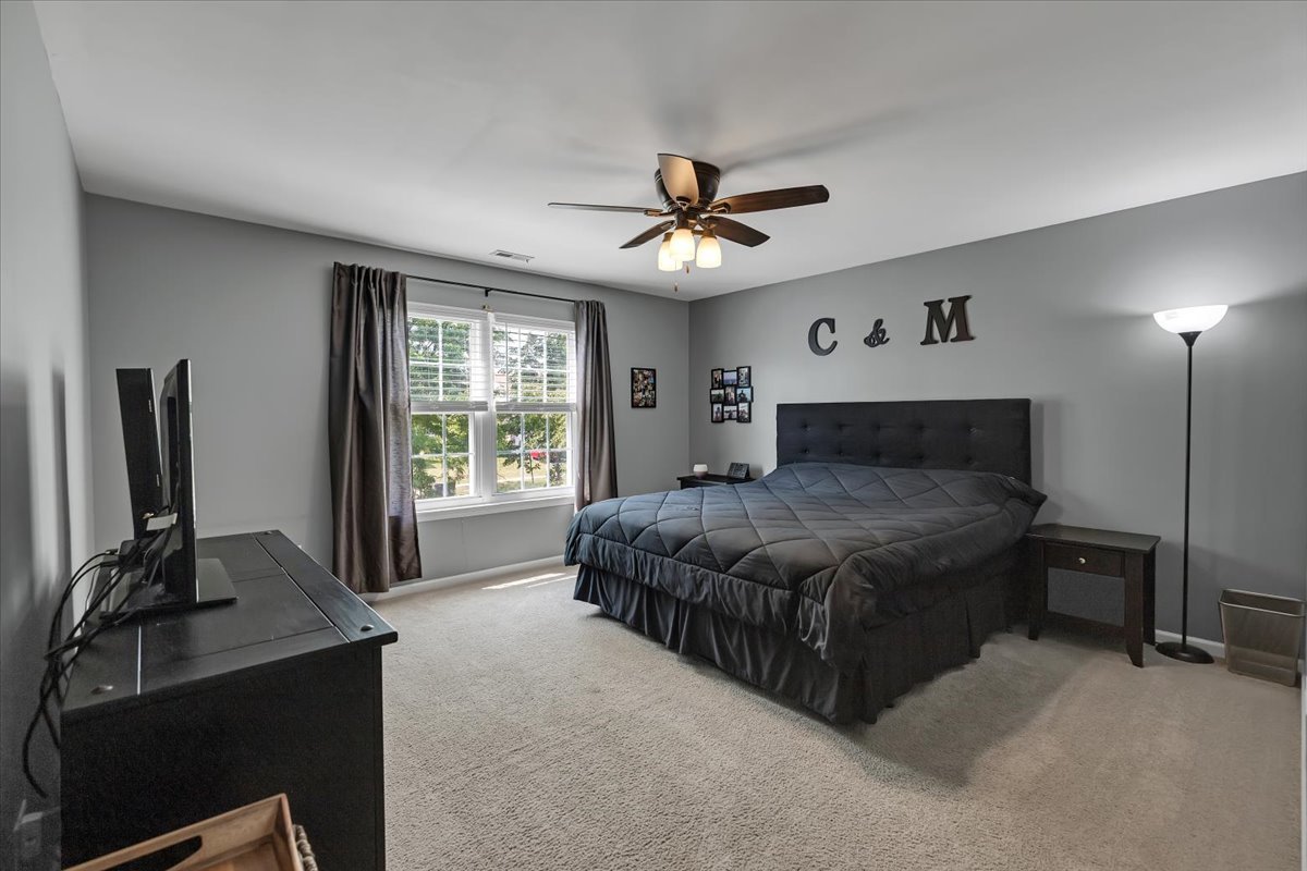 2070 Constitution Court Elgin, IL 60123 - Photo 16 of 29 a bedroom with a bed dresser and a window