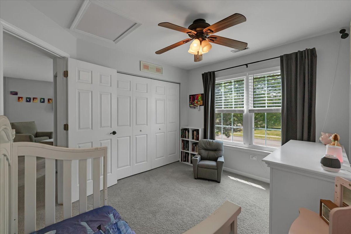2070 Constitution Court Elgin, IL 60123 - Photo 21 of 29 a living room with furniture and a large window