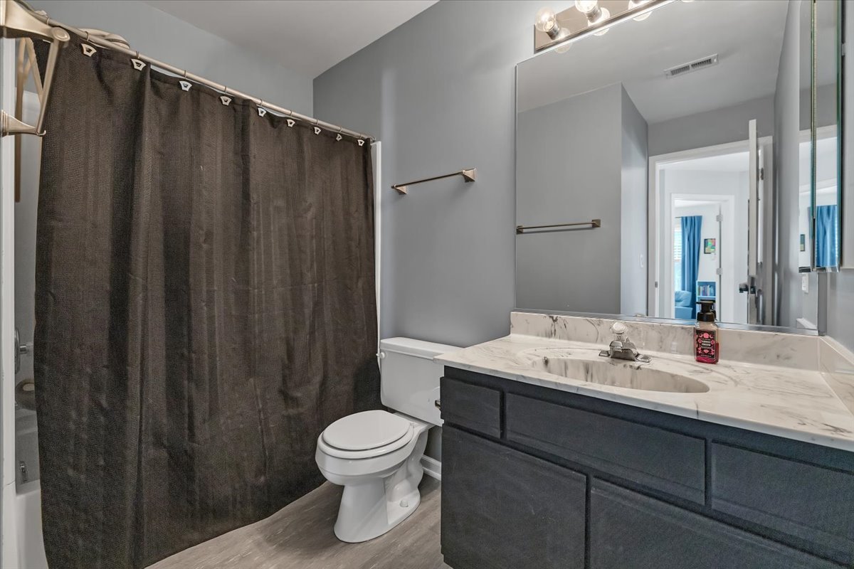 2070 Constitution Court Elgin, IL 60123 - Photo 22 of 29 a bathroom with a sink a toilet and shower