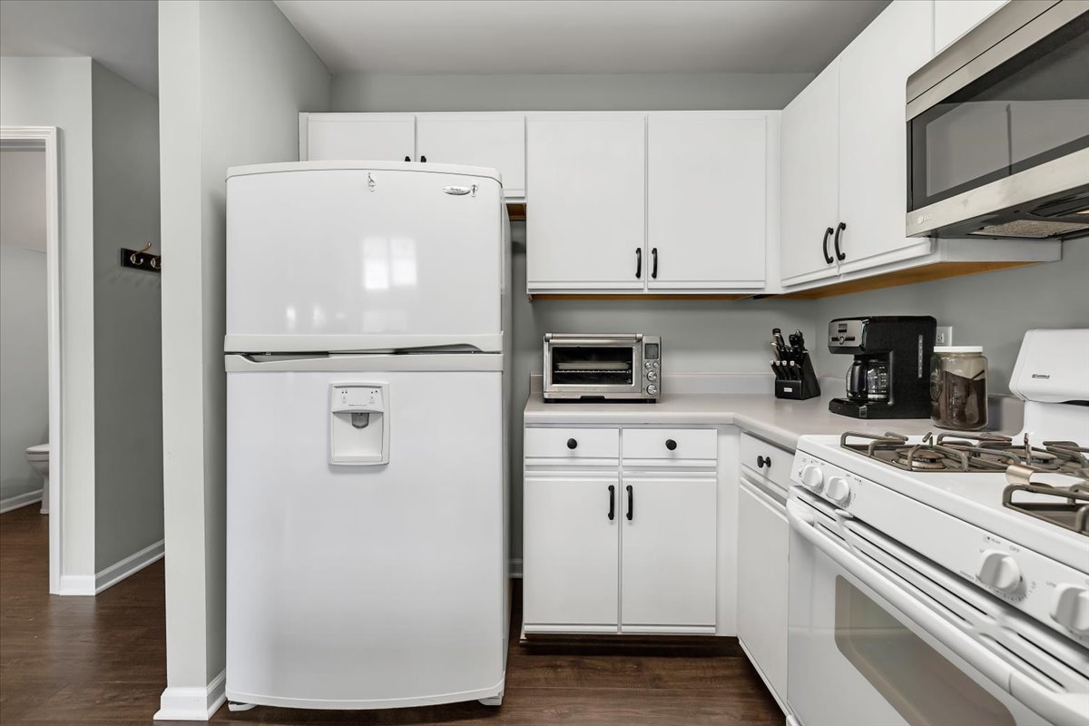 2070 Constitution Court Elgin, IL 60123 - Photo 7 of 29 a white refrigerator freezer sitting inside of a kitchen