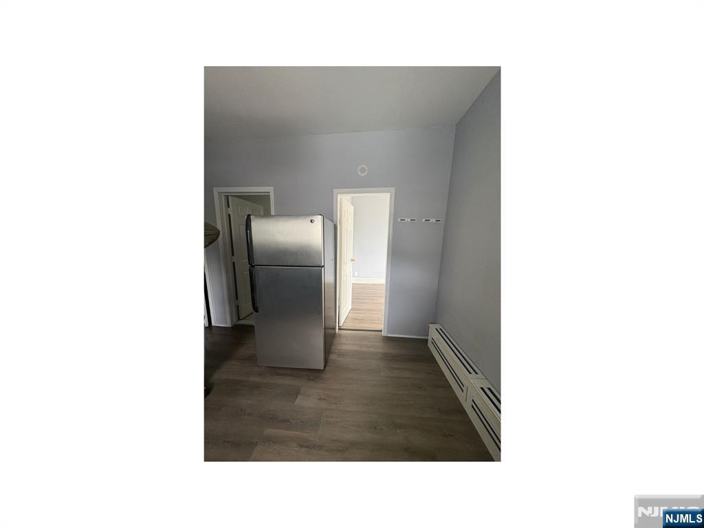 93 Highland Street, Unit 2 Paterson, NJ 07524 - Photo 4 of 9 a bathroom with a sink and mirror