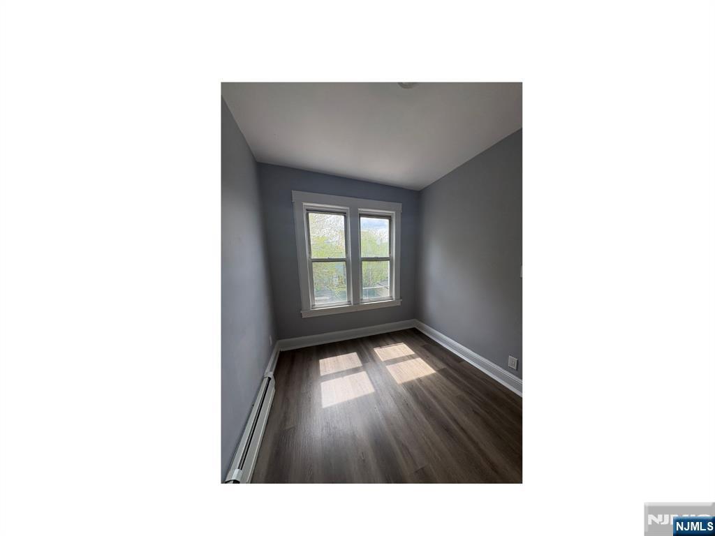 93 Highland Street, Unit 2 Paterson, NJ 07524 - Photo 7 of 9 a open space with a window