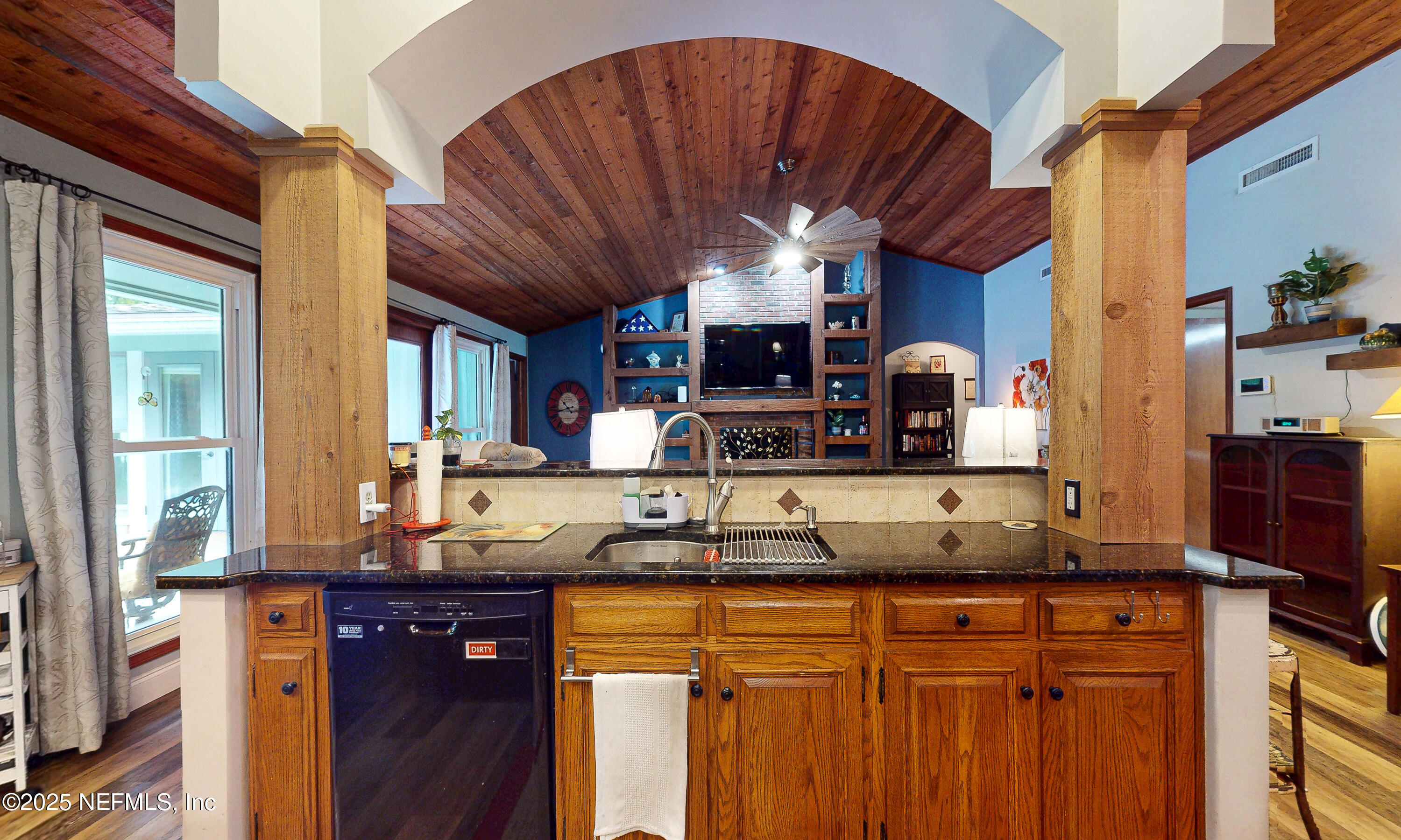 2860 Ravines Road Middleburg, FL 32068 - Photo 11 of 52 a kitchen with granite countertop a sink and a cabinets