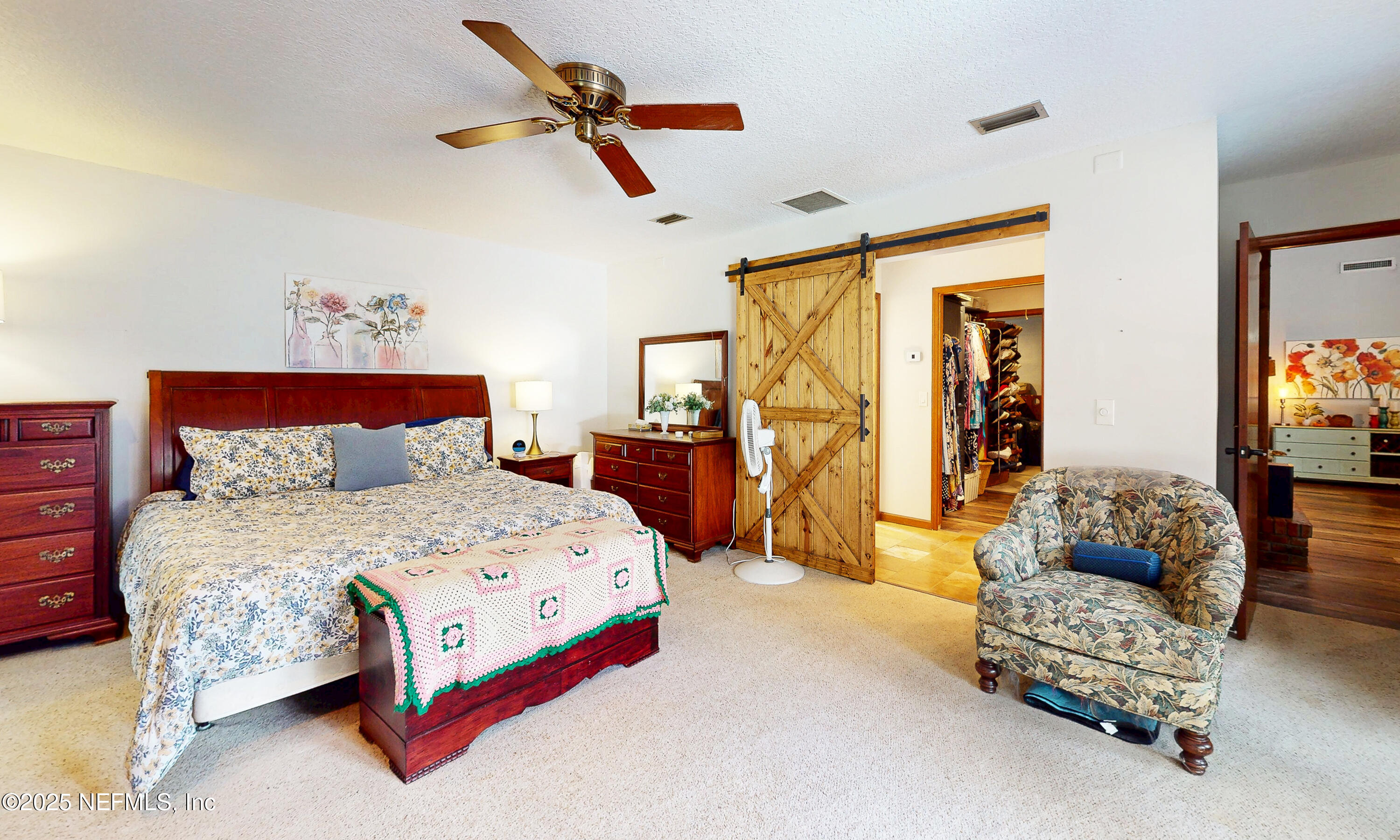 2860 Ravines Road Middleburg, FL 32068 - Photo 19 of 52 a bedroom with a bed couch and a window