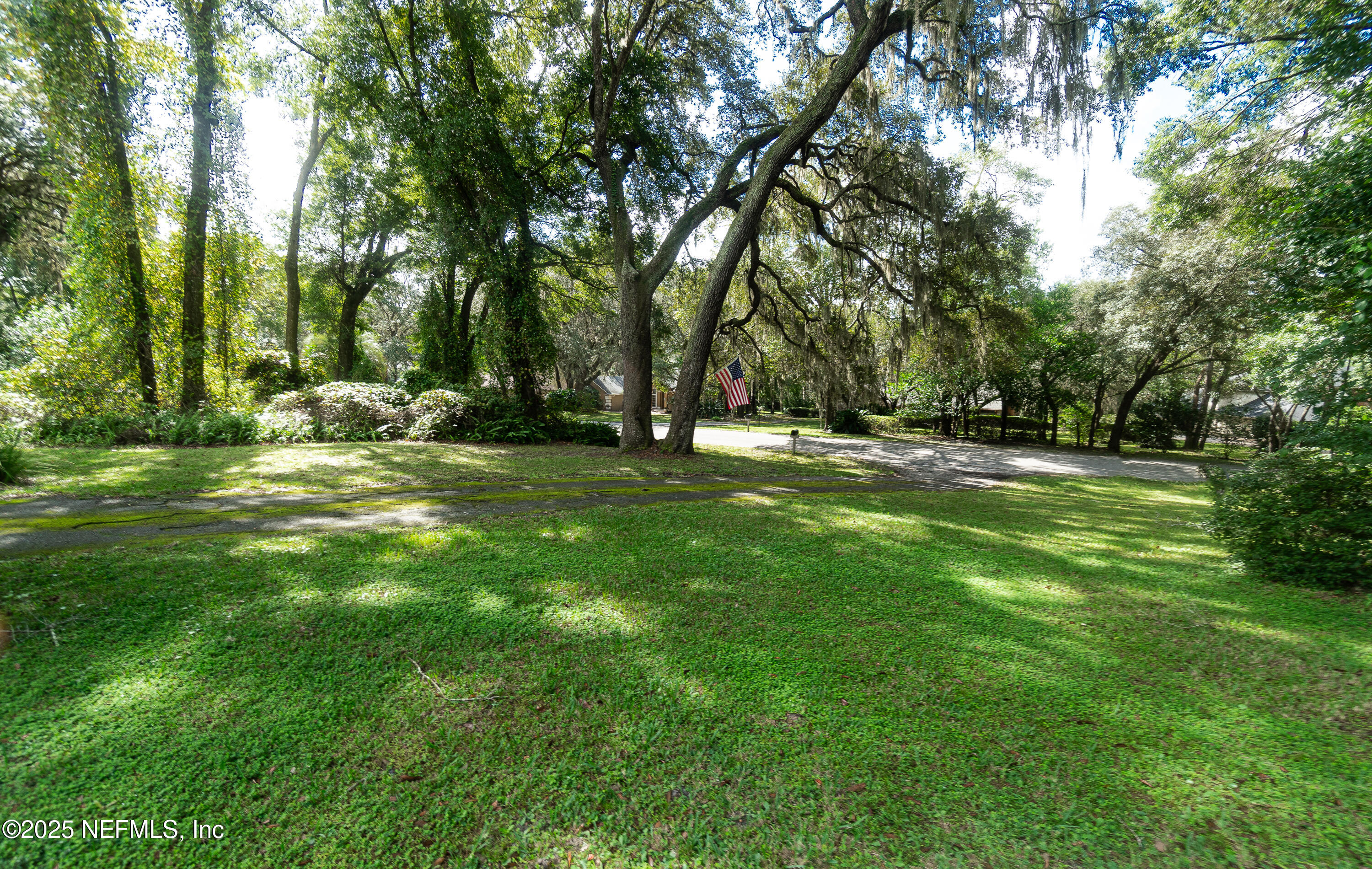 2860 Ravines Road Middleburg, FL 32068 - Photo 2 of 52 a view of a park with large trees