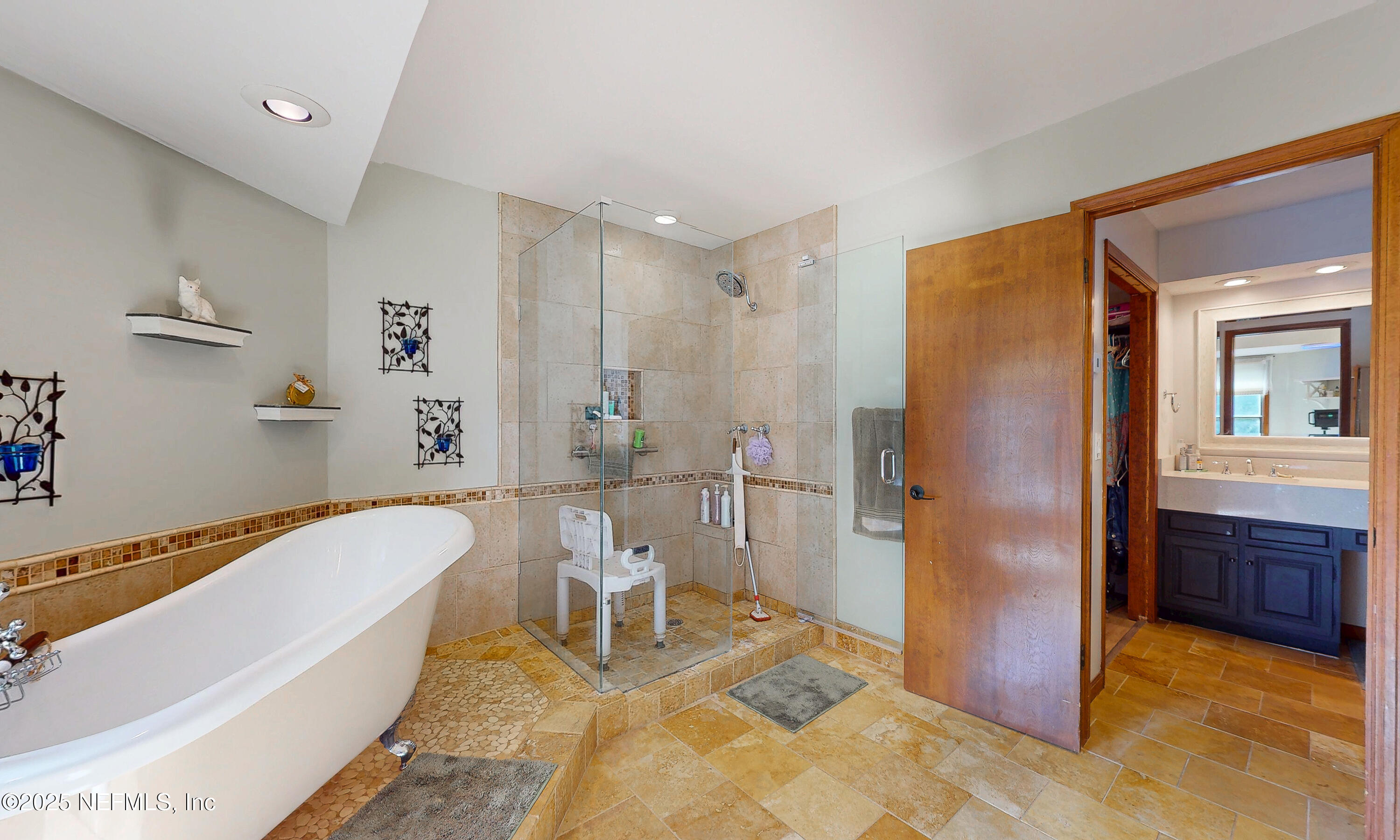 2860 Ravines Road Middleburg, FL 32068 - Photo 23 of 52 a bathroom with a tub a toilet and a shower