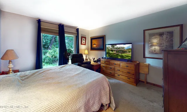 a bathroom with a sink vanity mirror and toilet