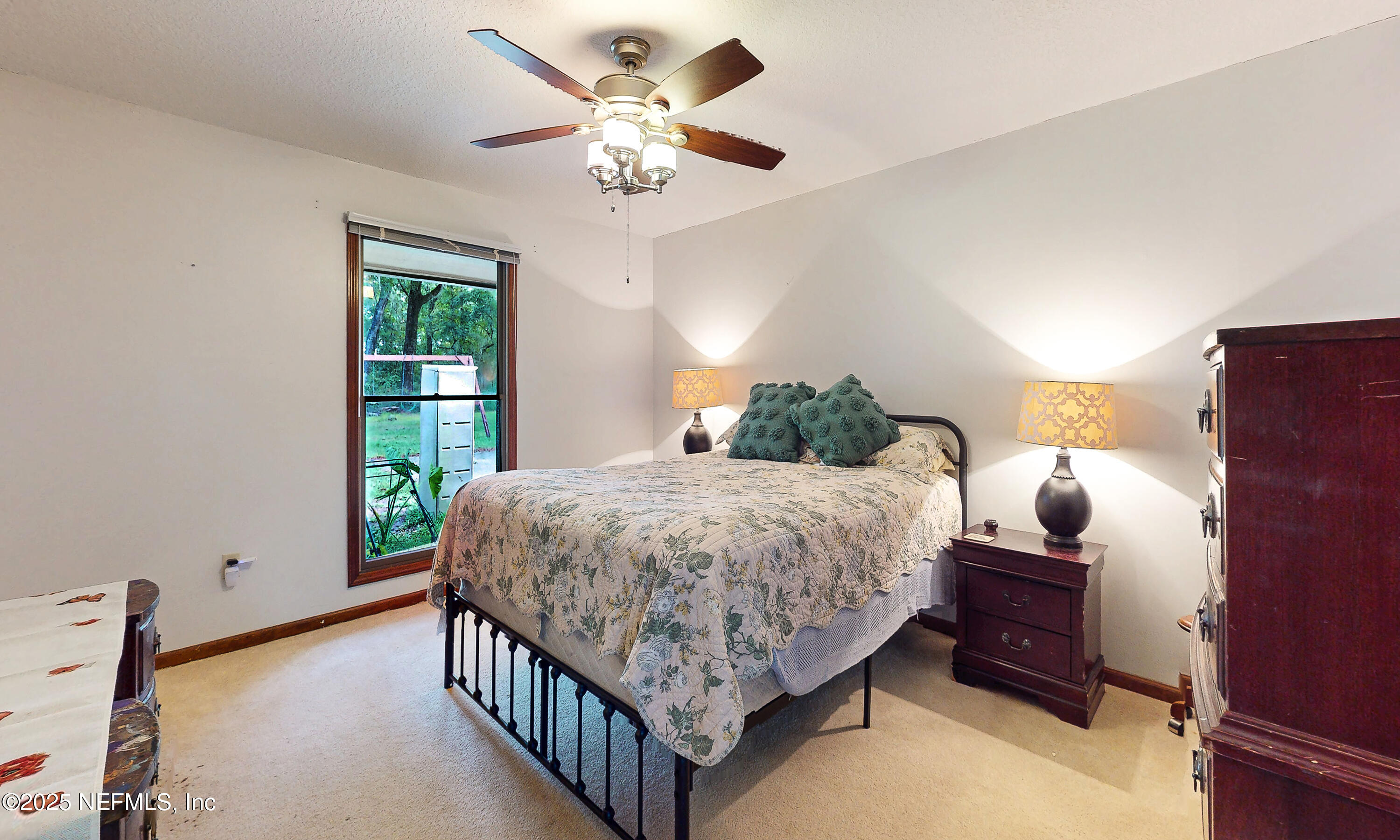 2860 Ravines Road Middleburg, FL 32068 - Photo 31 of 52 a bedroom with a bed and a window