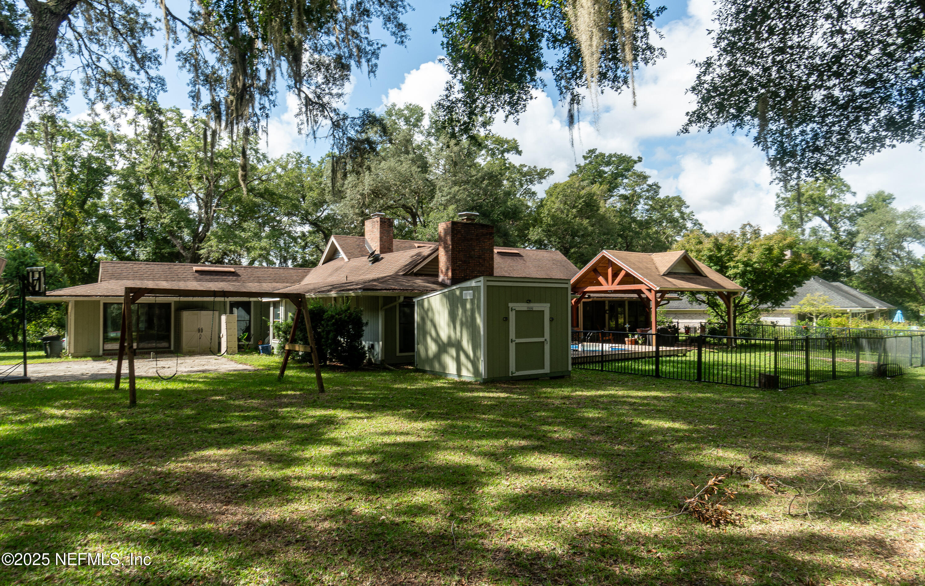 2860 Ravines Road Middleburg, FL 32068 - Photo 40 of 52 a front view of a house with a garden
