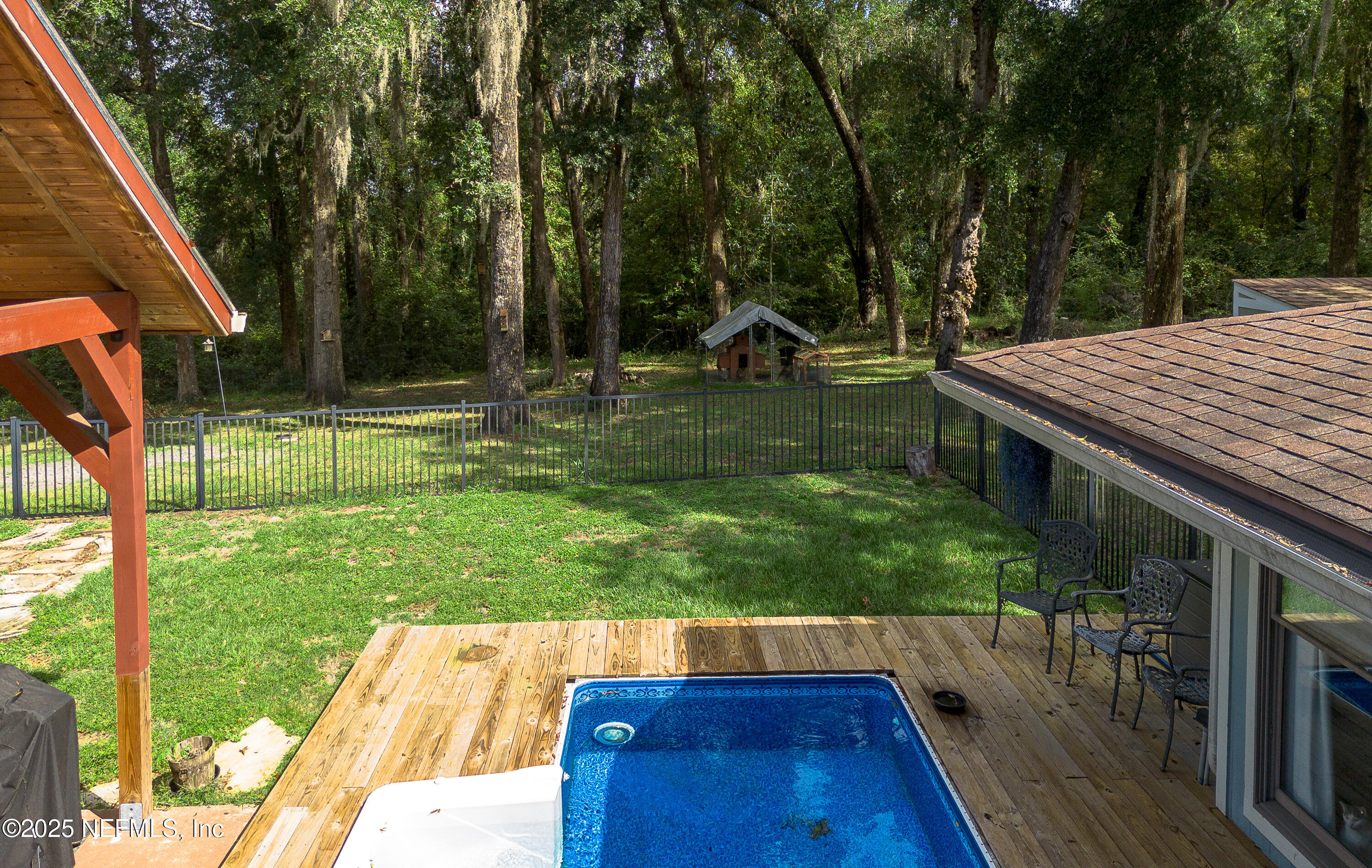 2860 Ravines Road Middleburg, FL 32068 - Photo 42 of 52 a view of backyard with trampoline