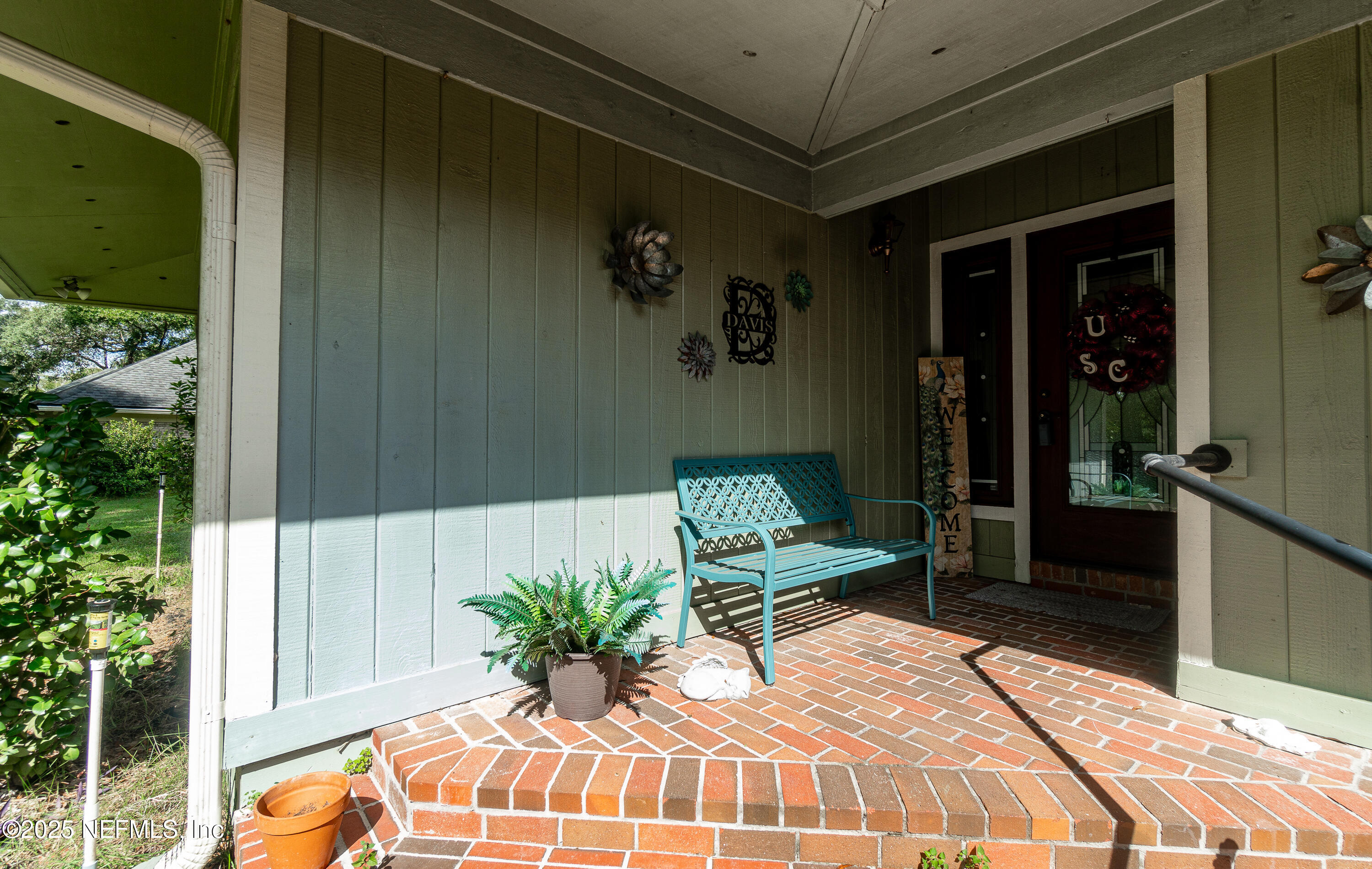 2860 Ravines Road Middleburg, FL 32068 - Photo 45 of 52 a bedroom with a bed and a potted plant