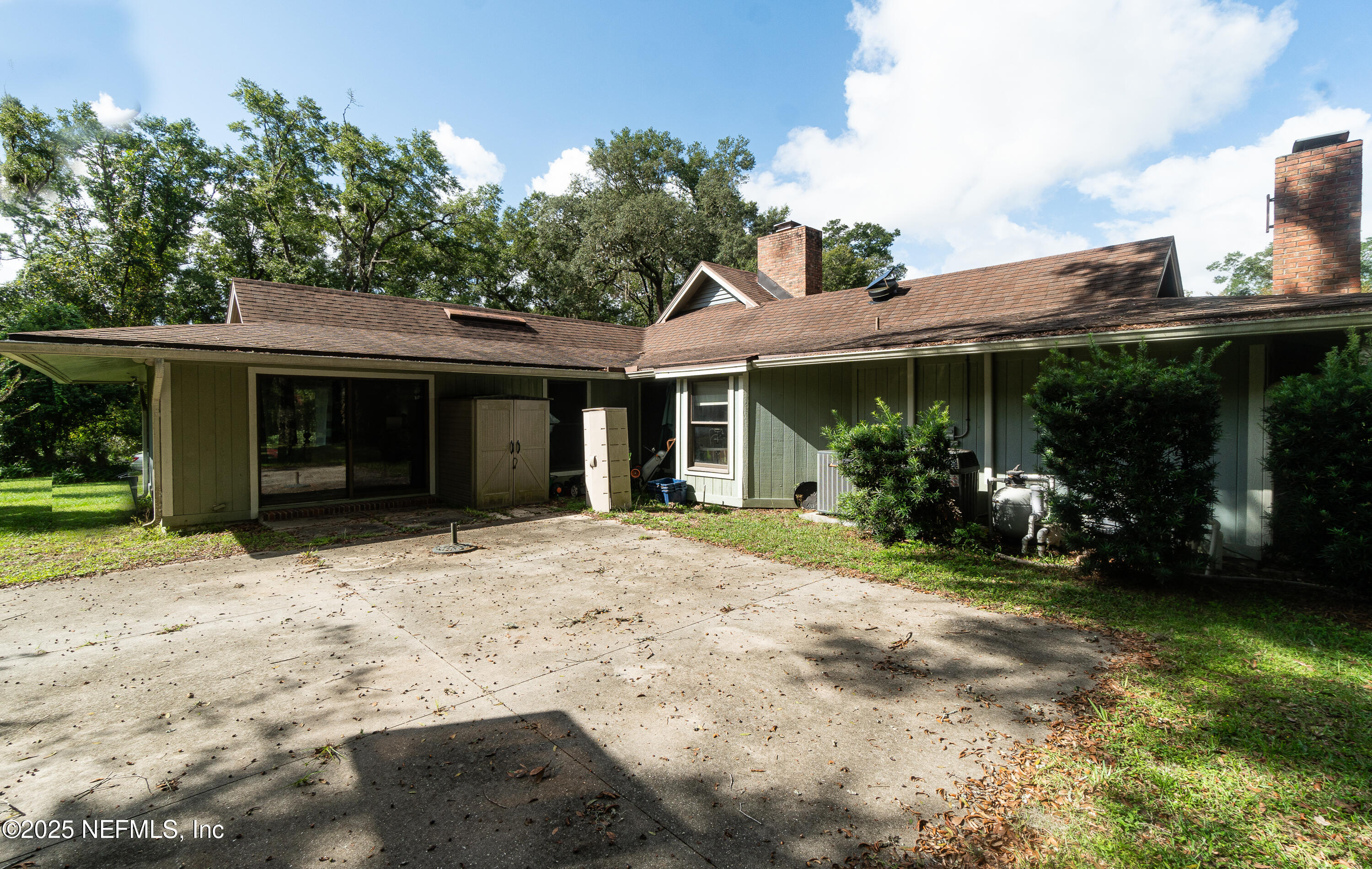 2860 Ravines Road Middleburg, FL 32068 - Photo 51 of 52 a front view of a house with garden and porch