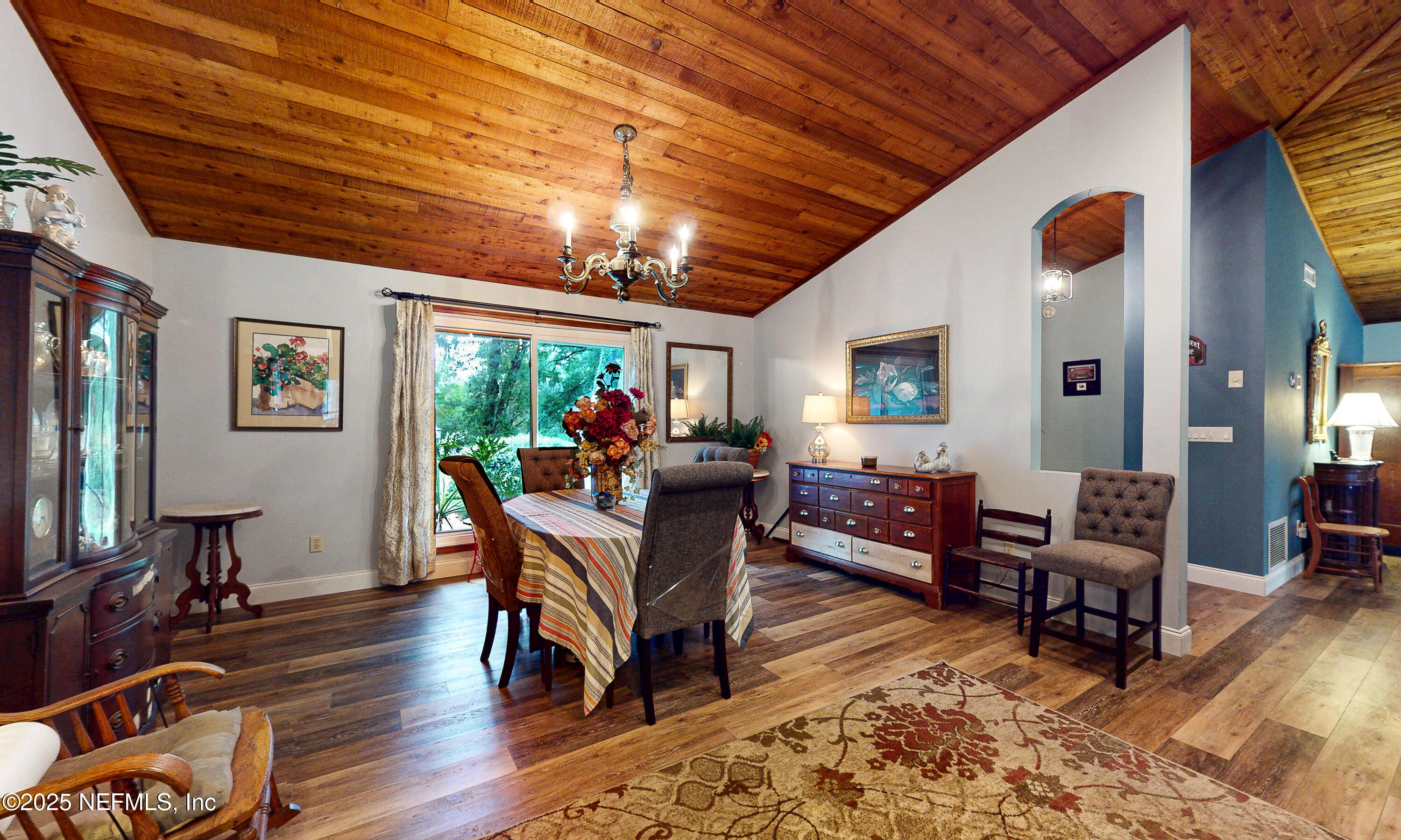 2860 Ravines Road Middleburg, FL 32068 - Photo 6 of 52 a living room with furniture and a wooden floor