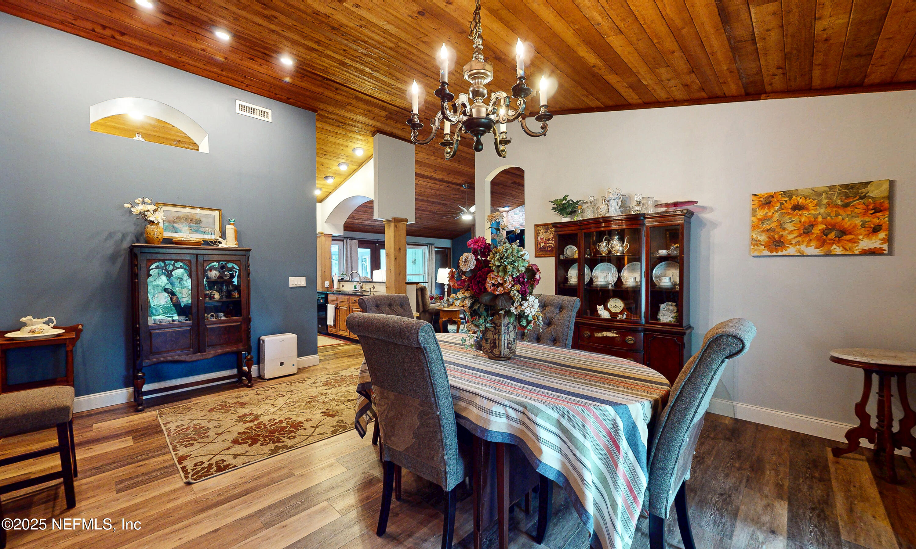 2860 Ravines Road Middleburg, FL 32068 - Photo 7 of 52 a view of a dining room with furniture and chandelier